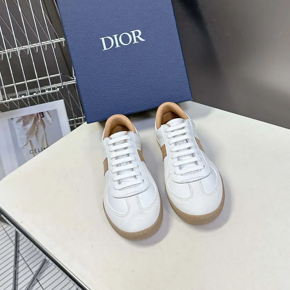 Close-up on white suede and Dior hardware detail on shoe heel