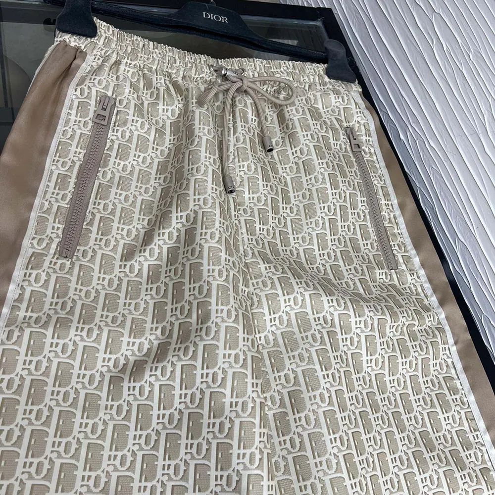 Side angle showing silhouette of Dior Women Flared Pants in gold-beige