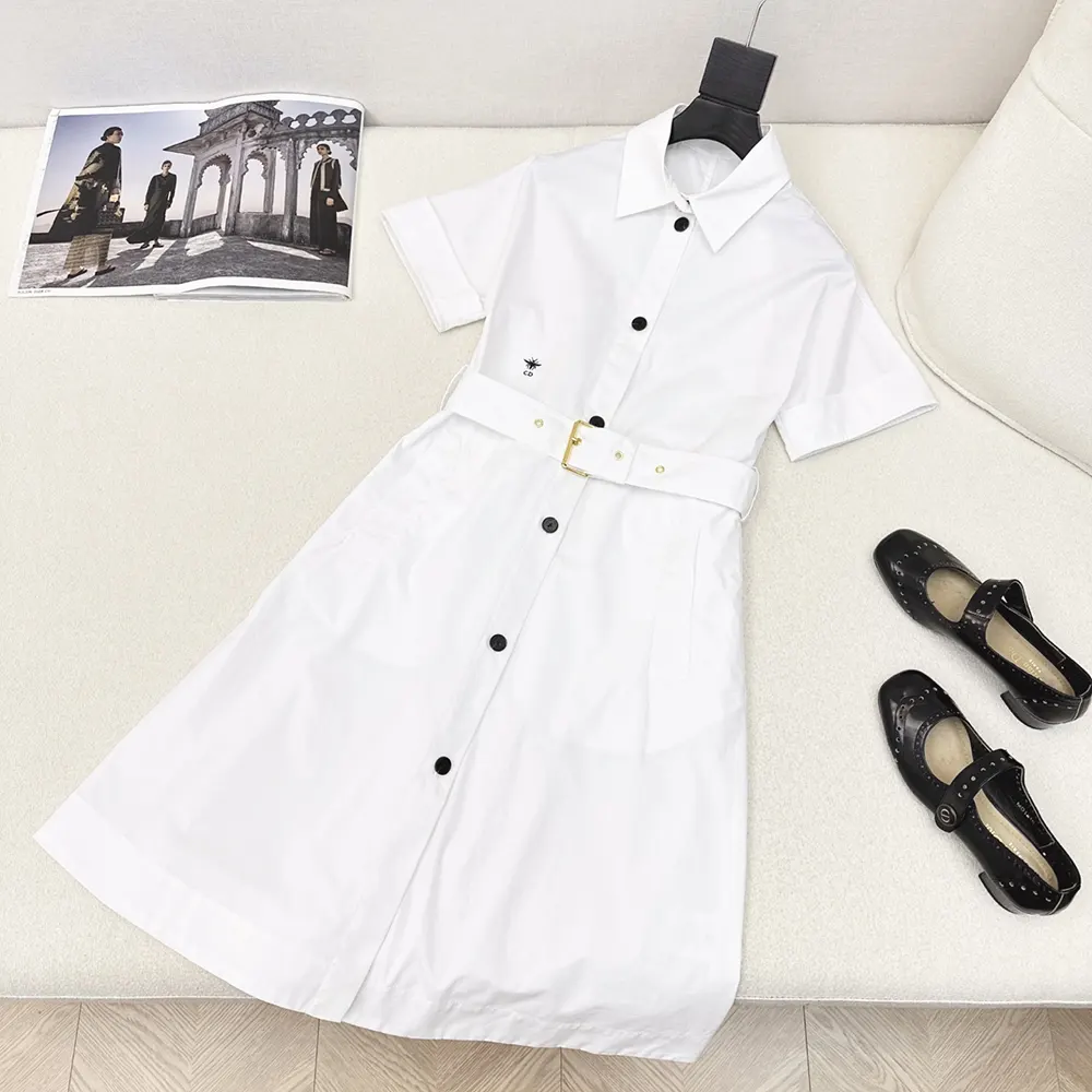 Close-up of belt and polished metal hardware on Dior shirtdress