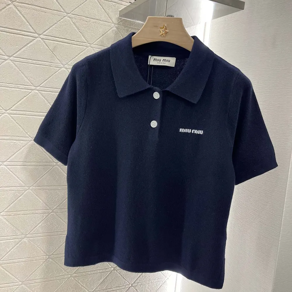 Close-up of Miu Miu Women Cotton Piqué Polo Shirt button and embroidery