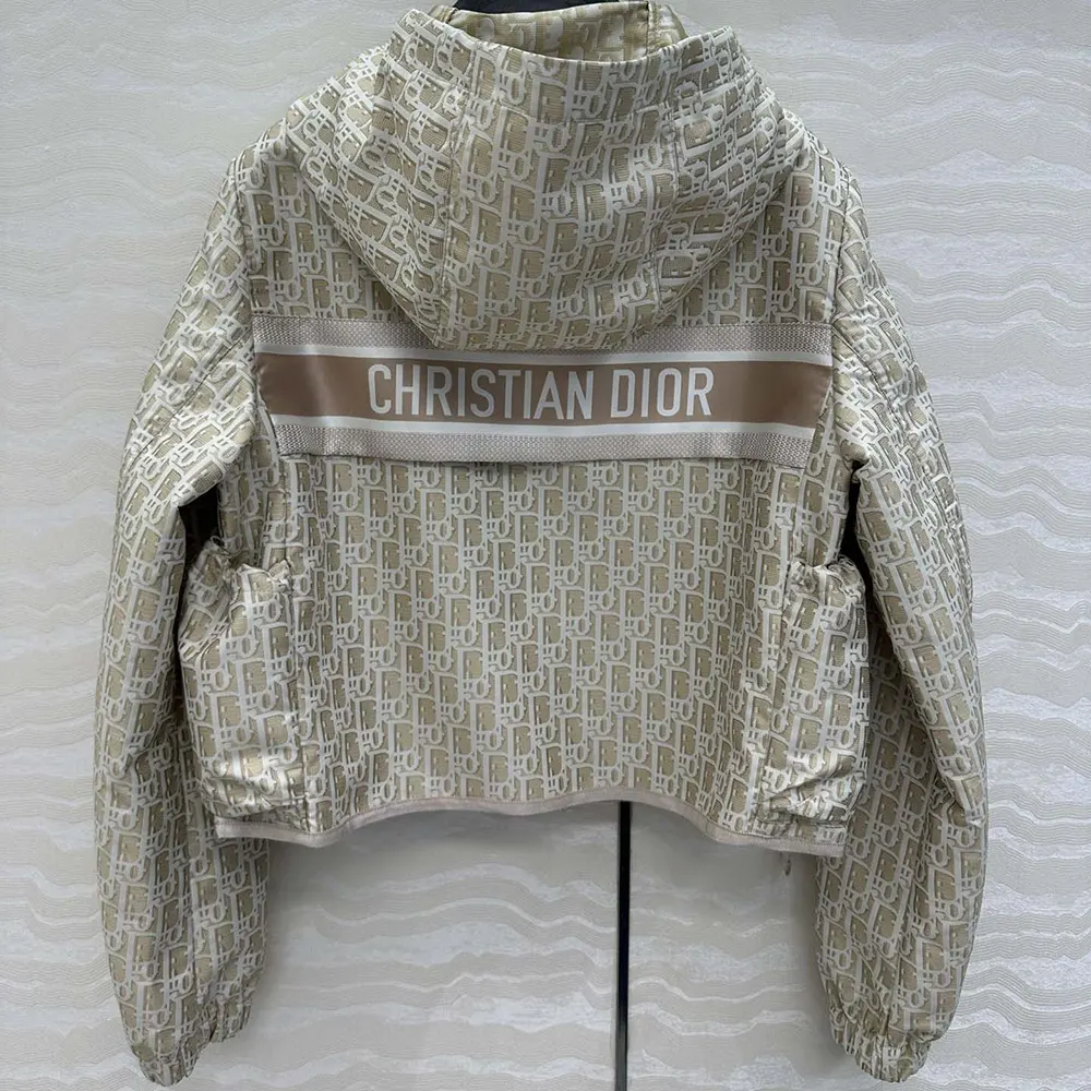 Side angle showing cropped silhouette and hood on Dior Men jacket