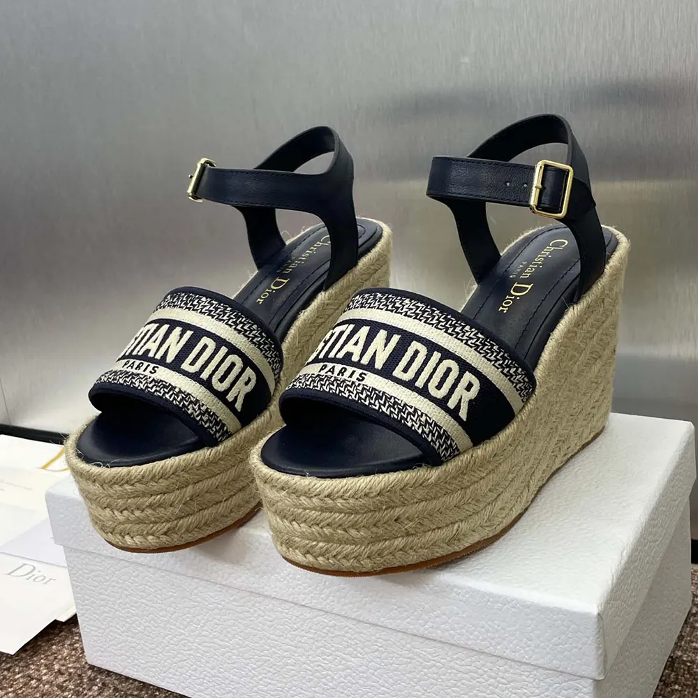 Close-up of embroidered cotton and gold buckle detail on Dior Women Dway Wedge Sandal