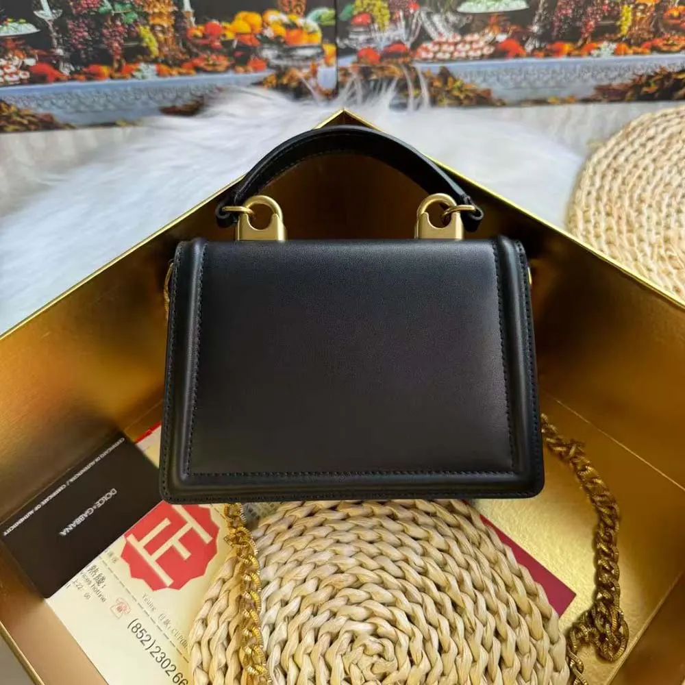 Side angle showing smooth calfskin texture on Dolce Gabbana D&G Devotion Bag