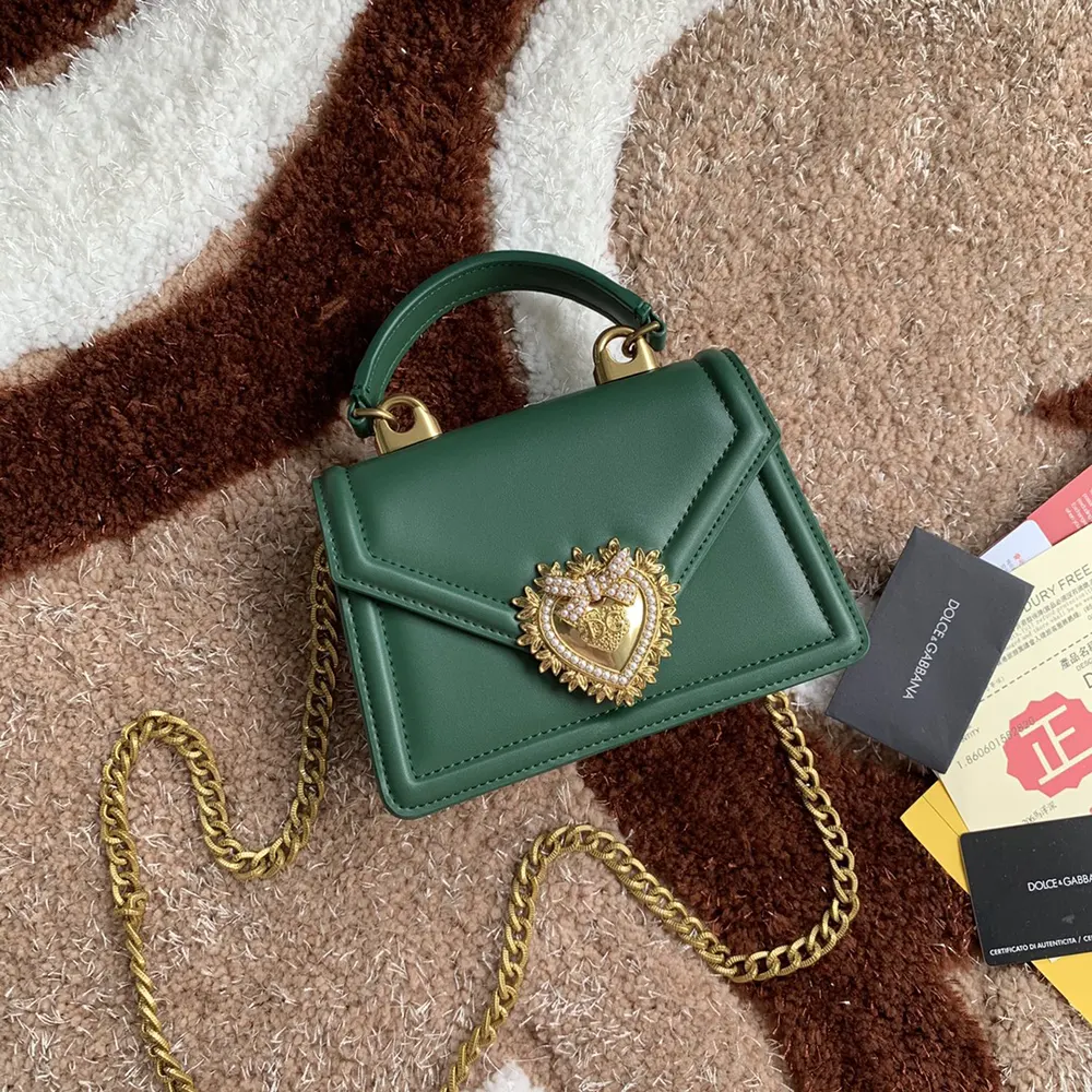 Close-up of gold heart clasp on Dolce Gabbana D&G Devotion Bag-Green