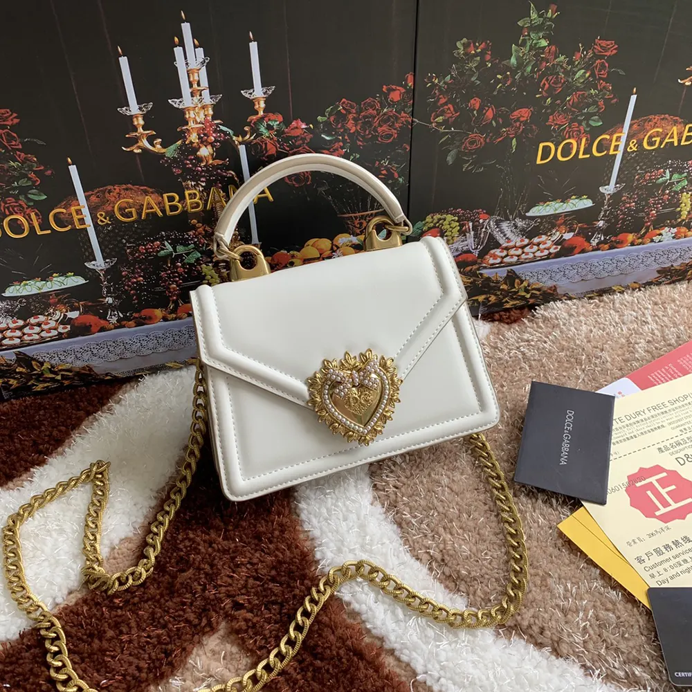 Close-up of heart clasp detail on Dolce Gabbana D&G Devotion Bag in white