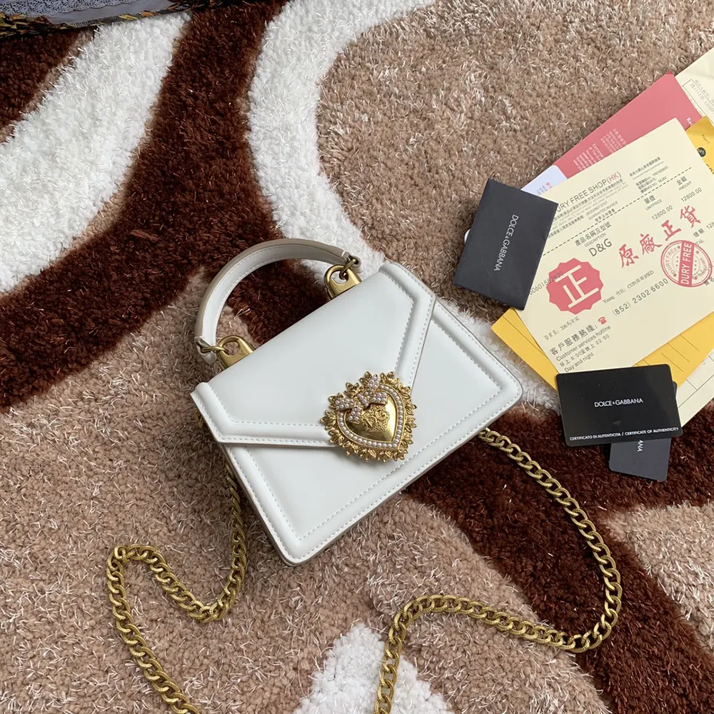 Side angle showing structured silhouette of Dolce Gabbana D&G Medium Devotion Bag