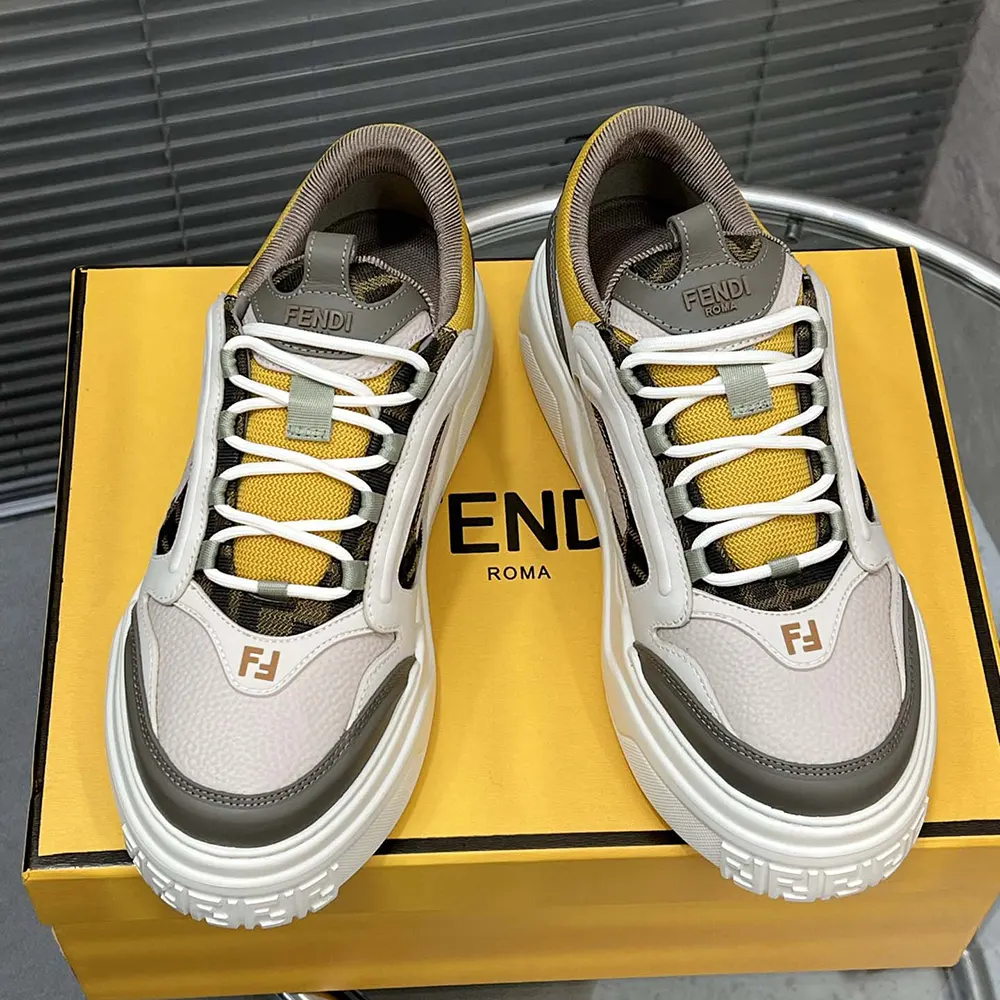 Close-up of yellow leather and embossed logo on Fendi Unisex Fendi Force Sneakers