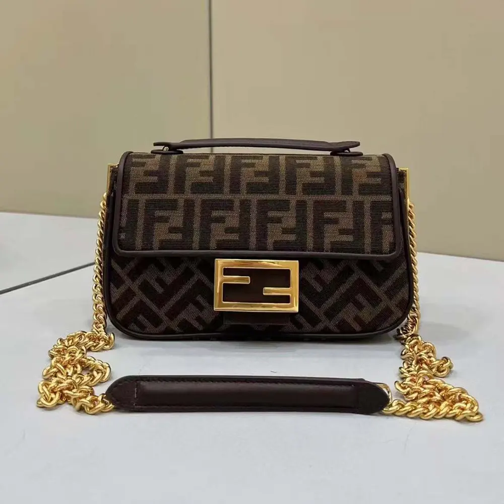 Close-up of gold chain and signature FF jacquard fabric on Fendi bag