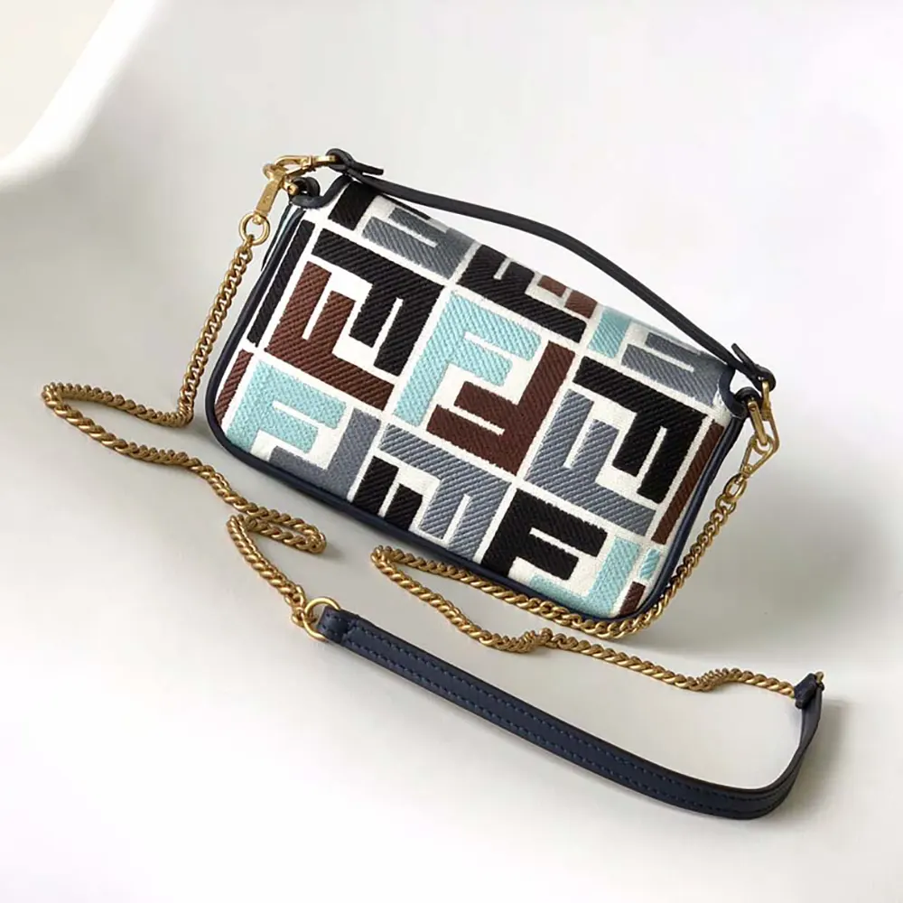Side angle highlighting gold-tone hardware of Fendi Women Baguette Mini Canvas Bag