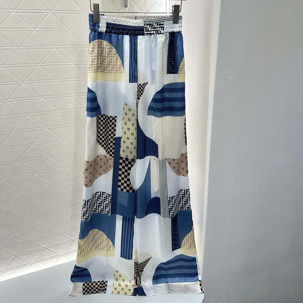 Close-up on patchwork print detail of Fendi Women Blue Silk Pants