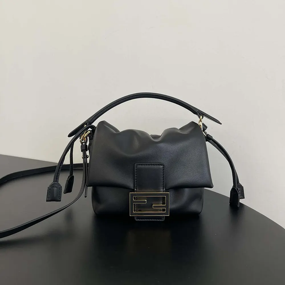 Close-up of gold-tone hardware on Fendi Women Mamma Baguette Small Black Nappa Leather Mini Bag