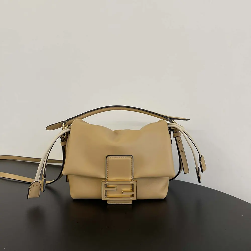 Close-up of gold-tone hardware on Fendi Mamma Baguette mini-bag