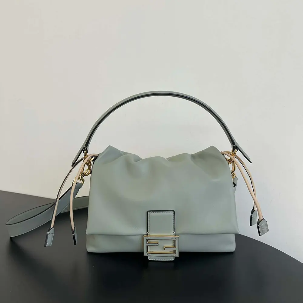 Close-up on gold Fendi hardware of the Matcha Green mini-bag
