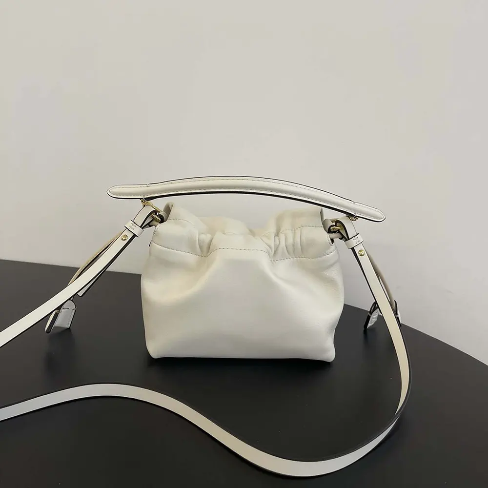 Side angle showing texture of white nappa leather on Fendi Mini Bag