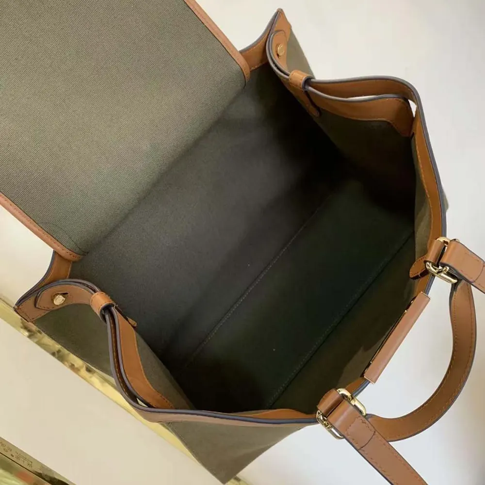 Side profile showcasing silhouette and canvas texture of Fendi Peekaboo X-Tote