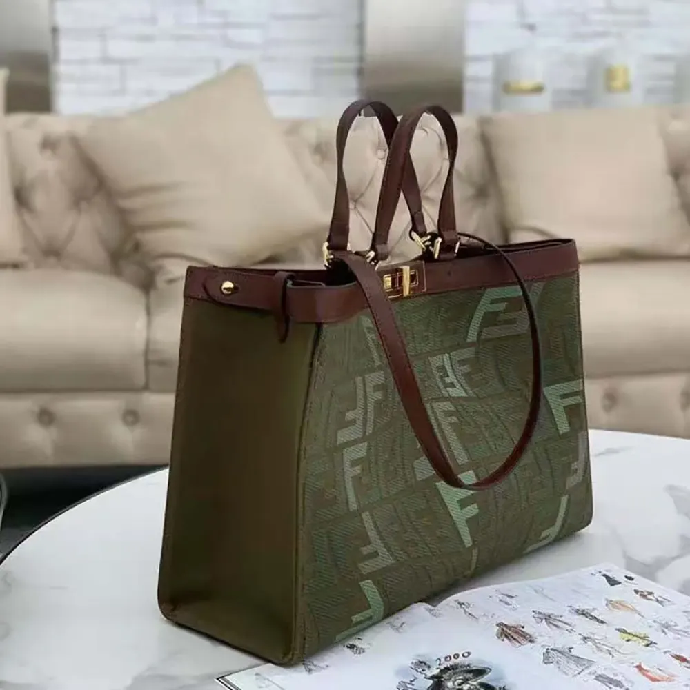 Side angle showing gold-tone hardware on Fendi Women Peekaboo X-Tote Bag