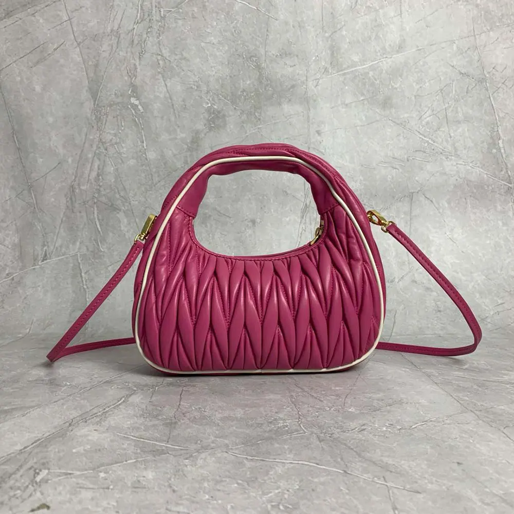 Side profile showing silver-tone hardware on Miu Miu Women Wander bag