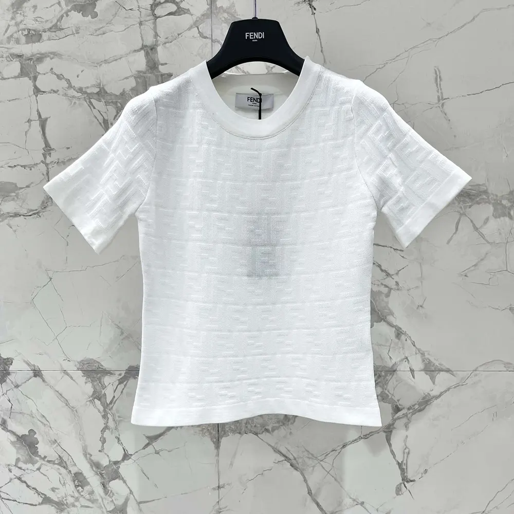 Side profile showing relaxed fit of Fendi Women White FF Viscose Jumper