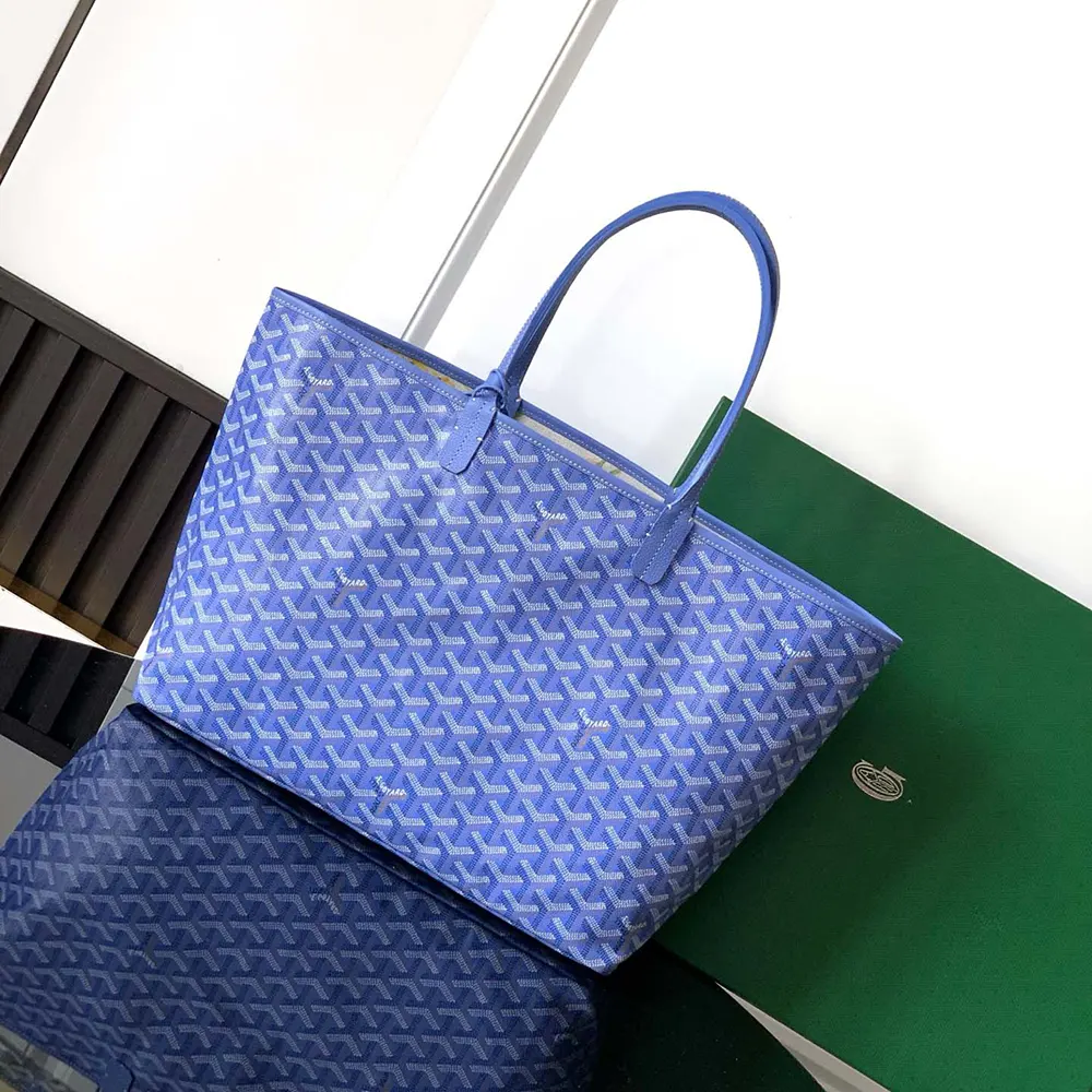 Side angle showing gold-tone hardware on Goyard Women Saint Louis GM Bag-Blue