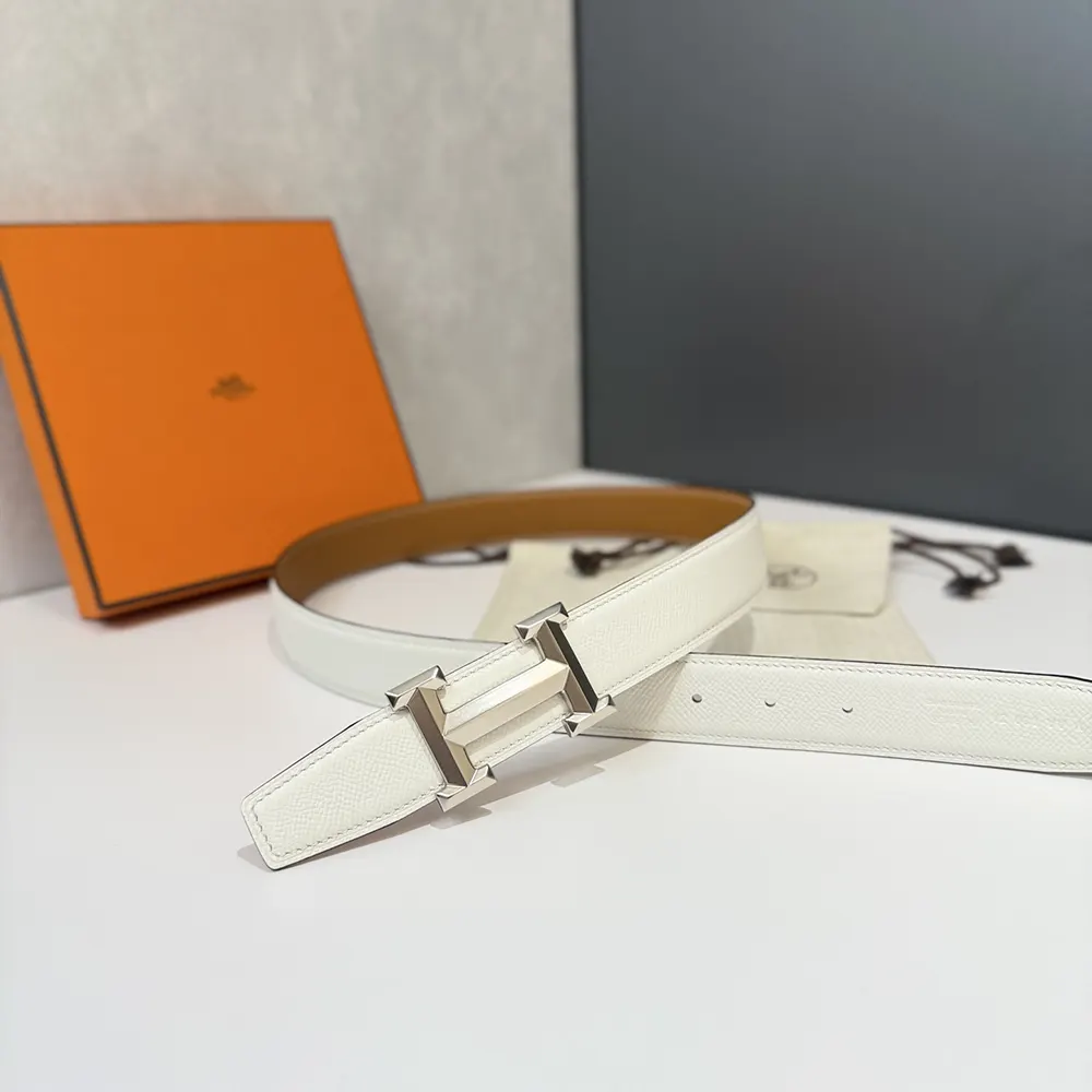 Side angle showing reversible leather strap colors of Hermes H Belt