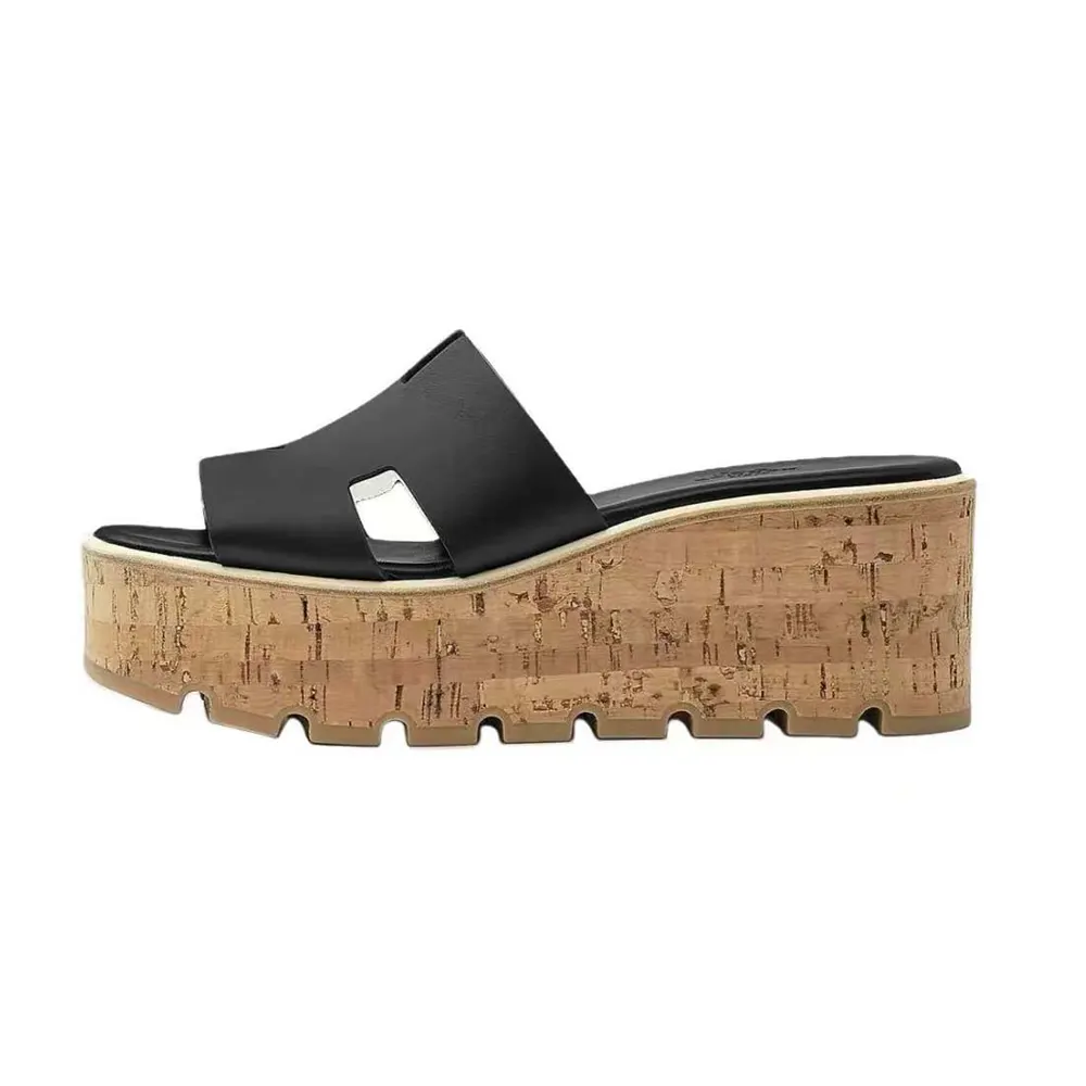 Side view of Hermes Women Eze 30 Sandal-Black showing heel shape