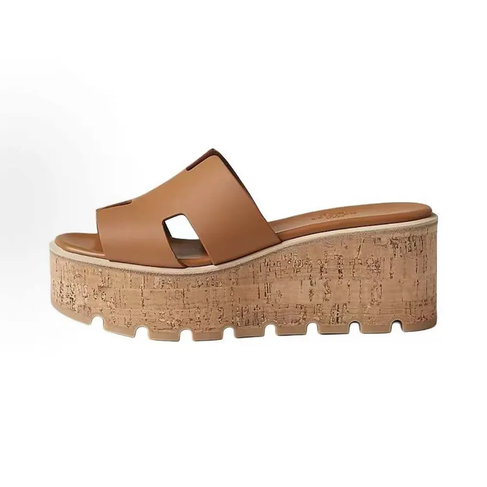 Side view of Hermes Women Eze 30 Sandal-Brown showing heel and buckle