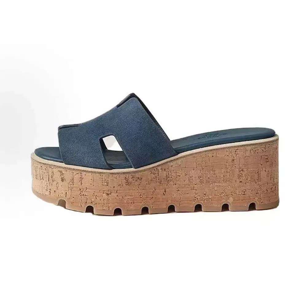 Side view of Hermes Women Eze 30 Sandal-Navy showing H-cut silhouette