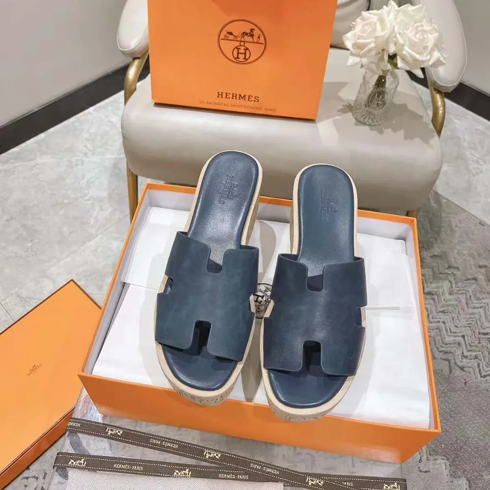 Close-up detail of navy leather and silver hardware on Hermes Women Eze 30 Sandal-Navy