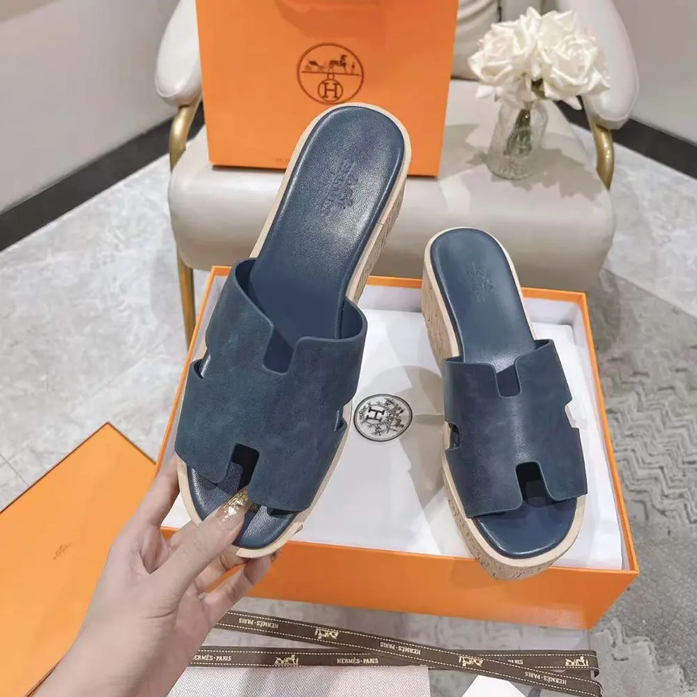 Back angle of Hermes Women Eze 30 Sandal-Navy highlighting leather craftsmanship