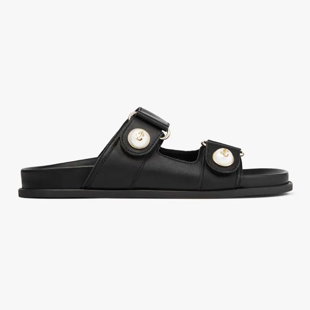 Side view of Jimmy Choo Women Fayence Sandal Black Leather Flat Sandals with Pearl Embellishment