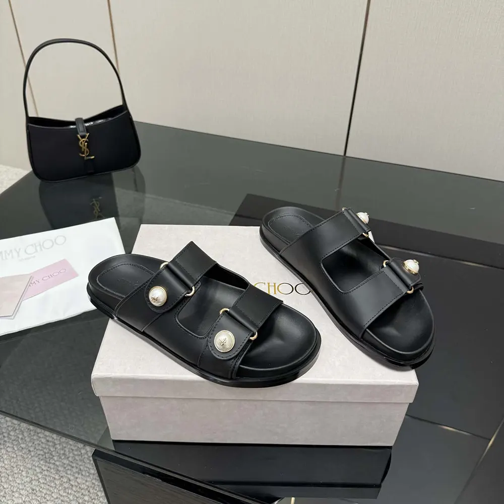Top view showing ankle strap on Jimmy Choo Women Fayence Sandal flat sandals