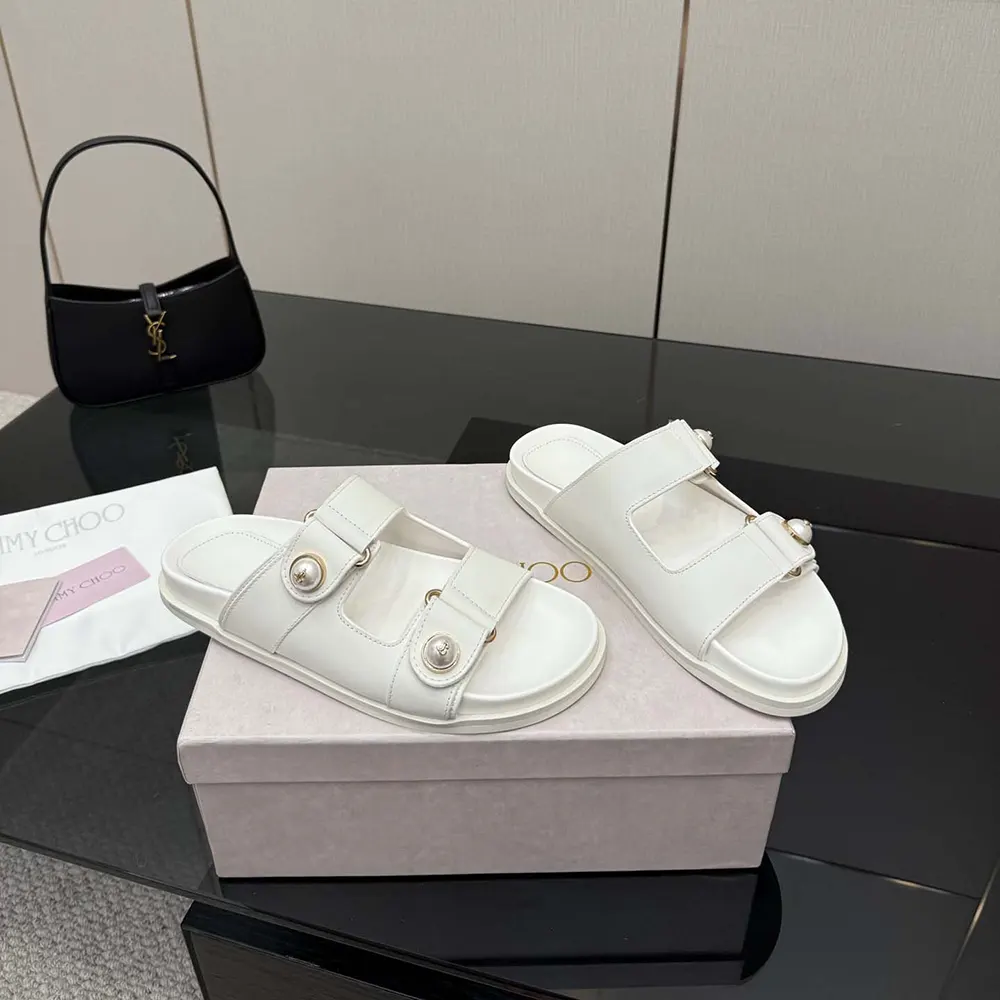 Top-down shot of Jimmy Choo Fayence Sandal Latte leather flat sandal in white