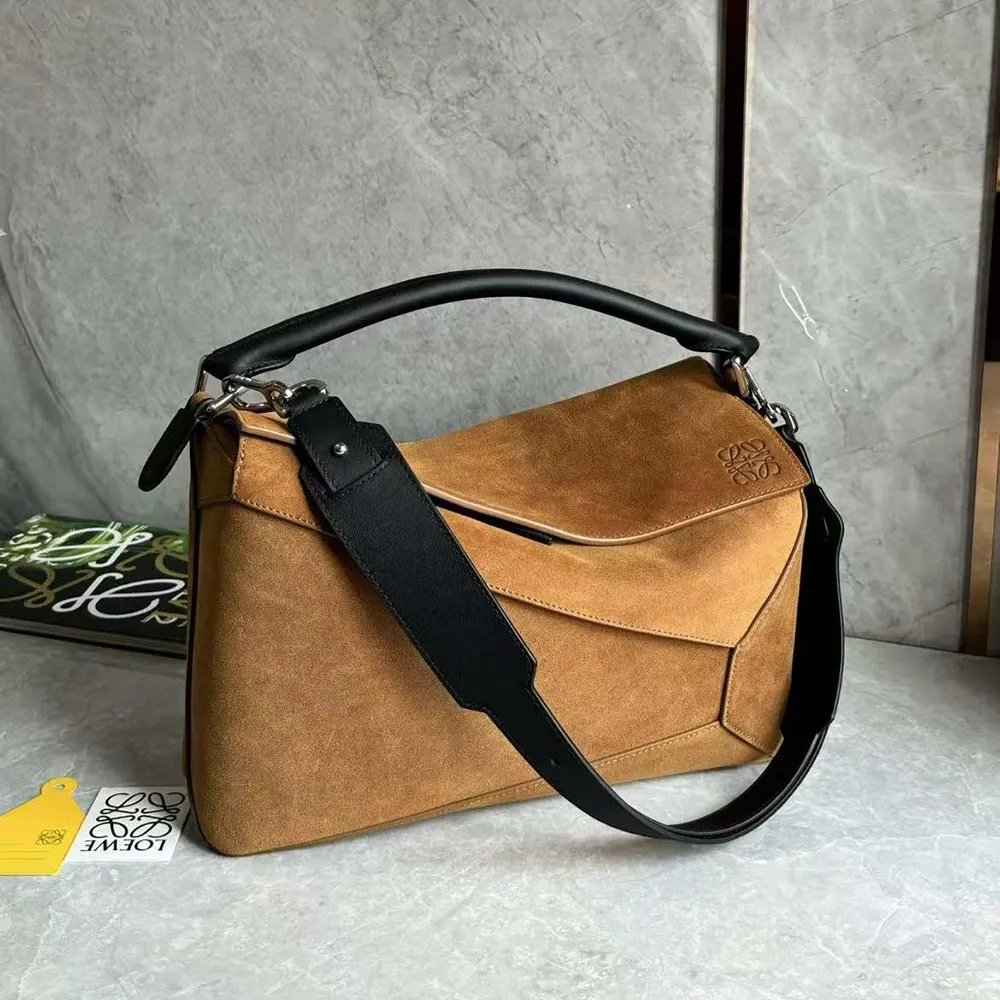 Side angle showcasing geometric leather panels of Loewe Puzzle Bag