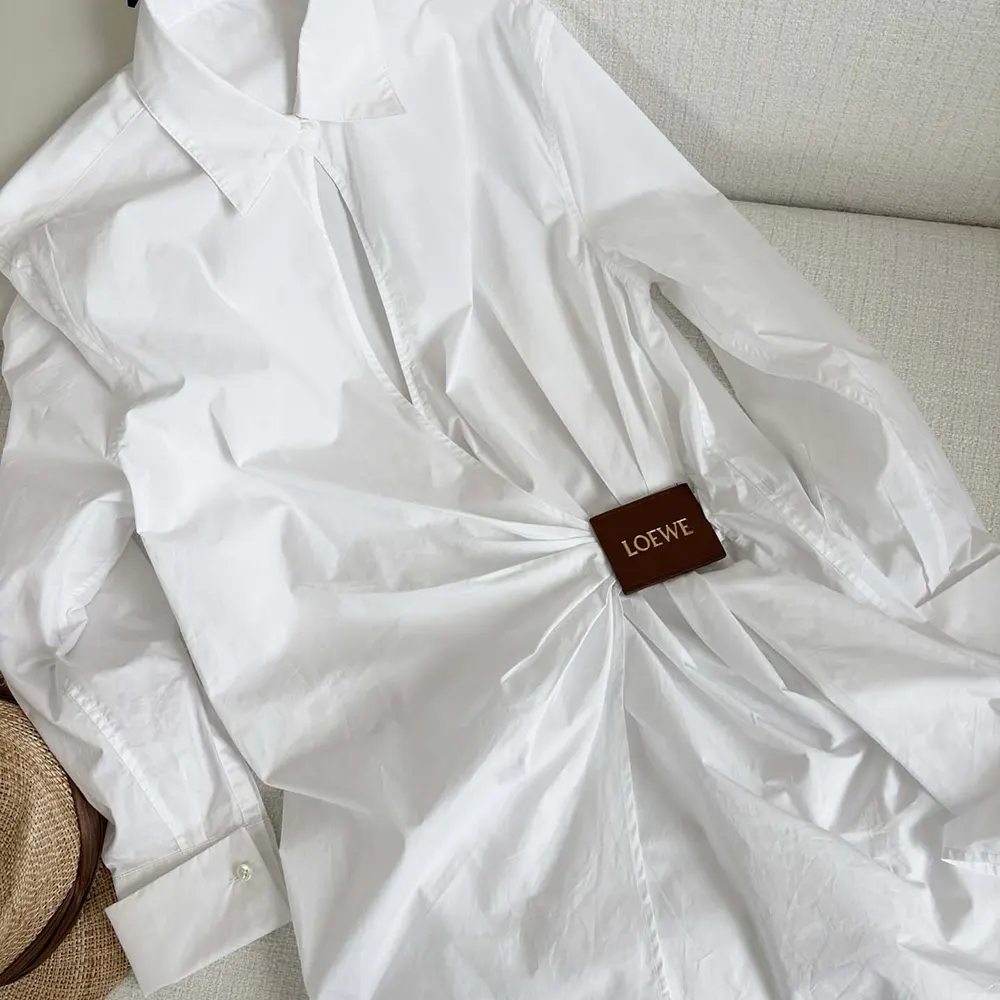 Close-up of cotton fabric and button details on Loewe Women Draped Shirt