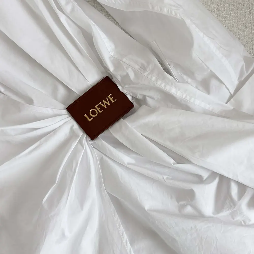 Side angle showing the relaxed silhouette of Loewe Women Draped Shirt