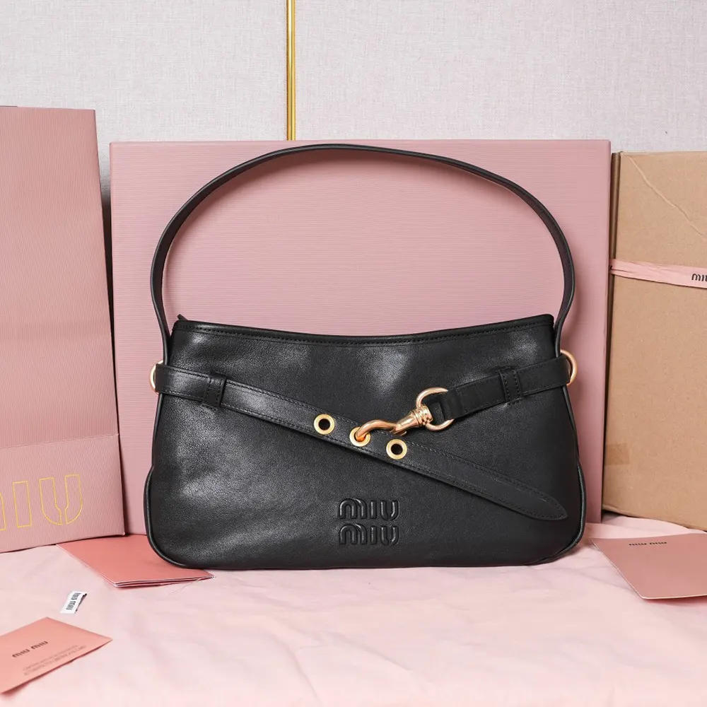 Close-up of silver-tone hardware on Miu Miu Women Aventure Nappa Leather Bag-Black