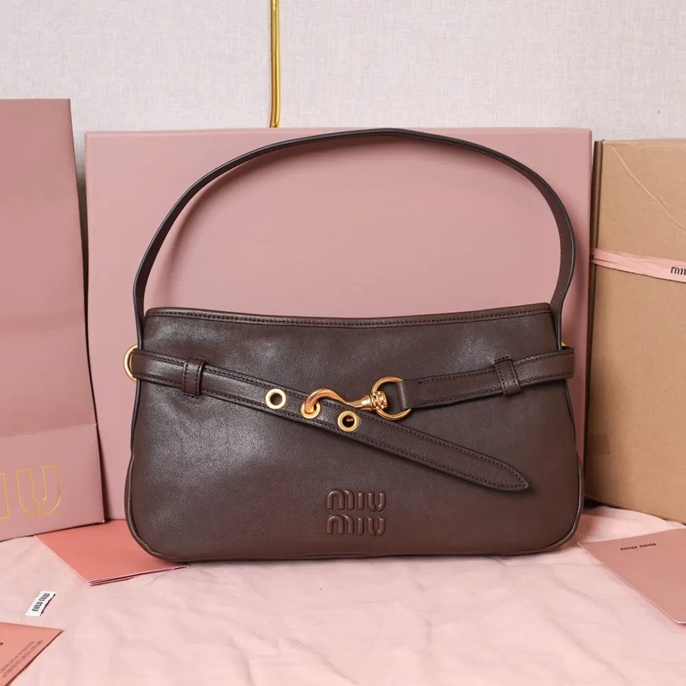 Close-up of gold-tone hardware on Miu Miu Women Aventure Nappa Leather Bag-Briarwood