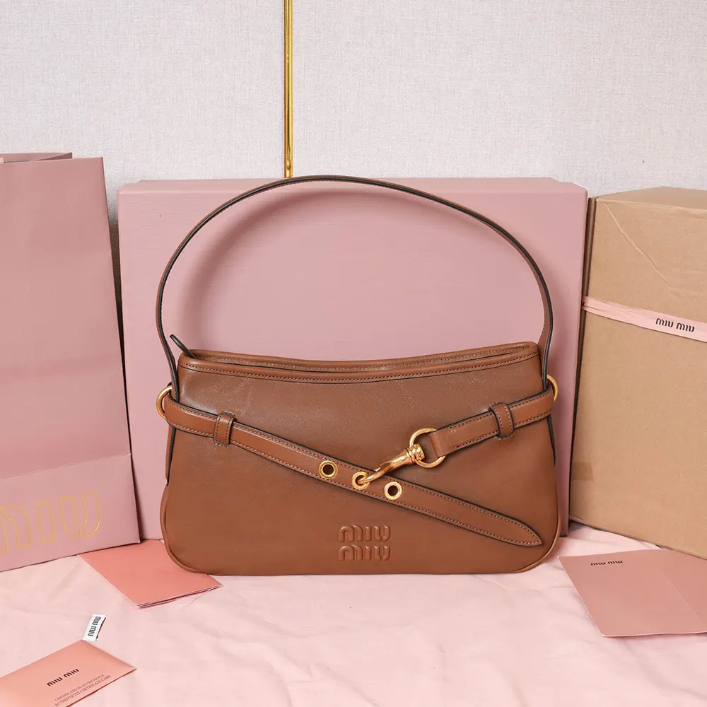 Close-up of silver-tone hardware on Miu Miu Women Aventure Nappa Leather Bag-Brown
