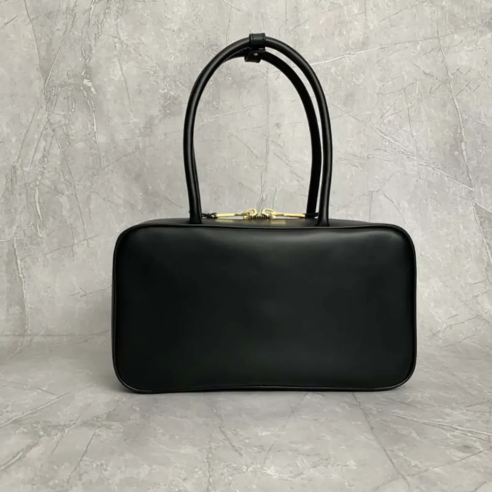 Side profile showing silhouette of Miu Miu Women Beau Leather Top-handle Bag-Black
