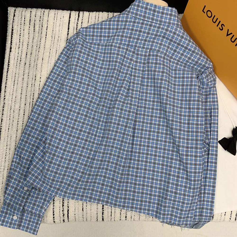 Close-up on button and cuff detail of Miu Miu Women Checked Poplin Shirt