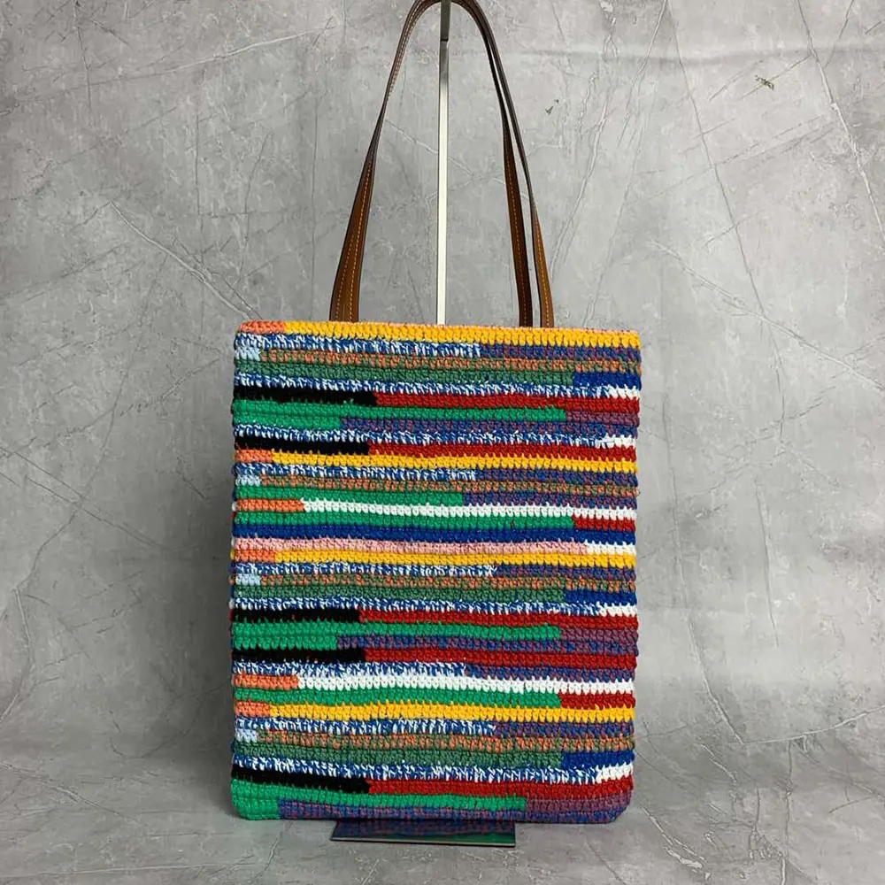 Side angle showing spacious interior of Miu Miu Women Crochet Tote Bag