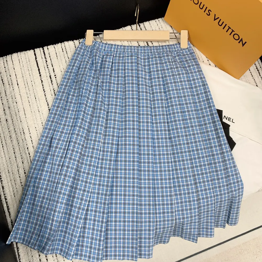 Close-up detail of pleated fabric on Miu Miu Women Pleated Check Skirt