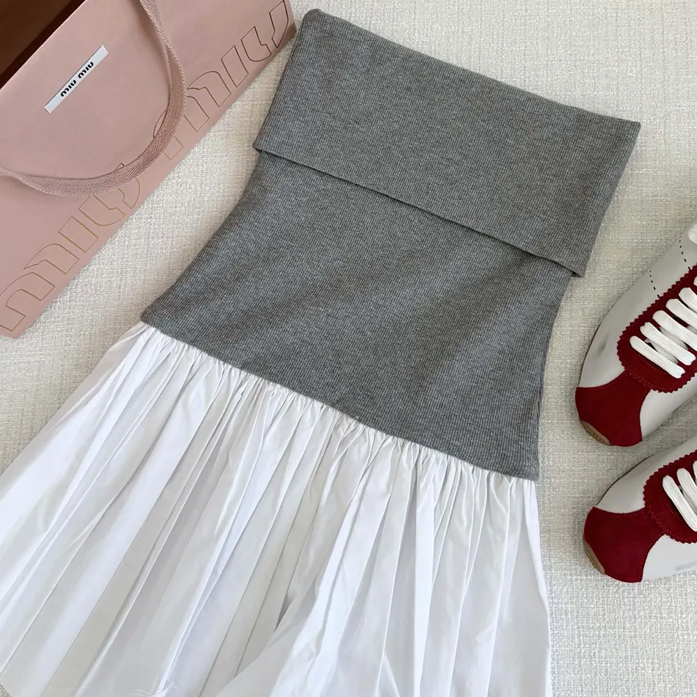 Close-up detail of fabric contrast on Miu Miu Women Poplin and Jersey Miniskirt-White