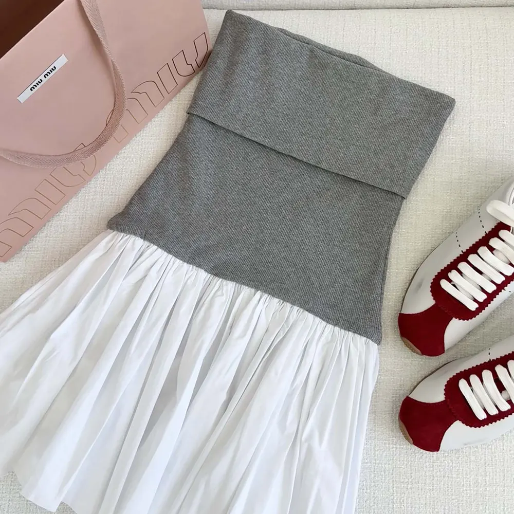 Side angle highlighting concealed zip and fit on Miu Miu Women Poplin and Jersey Miniskirt-White