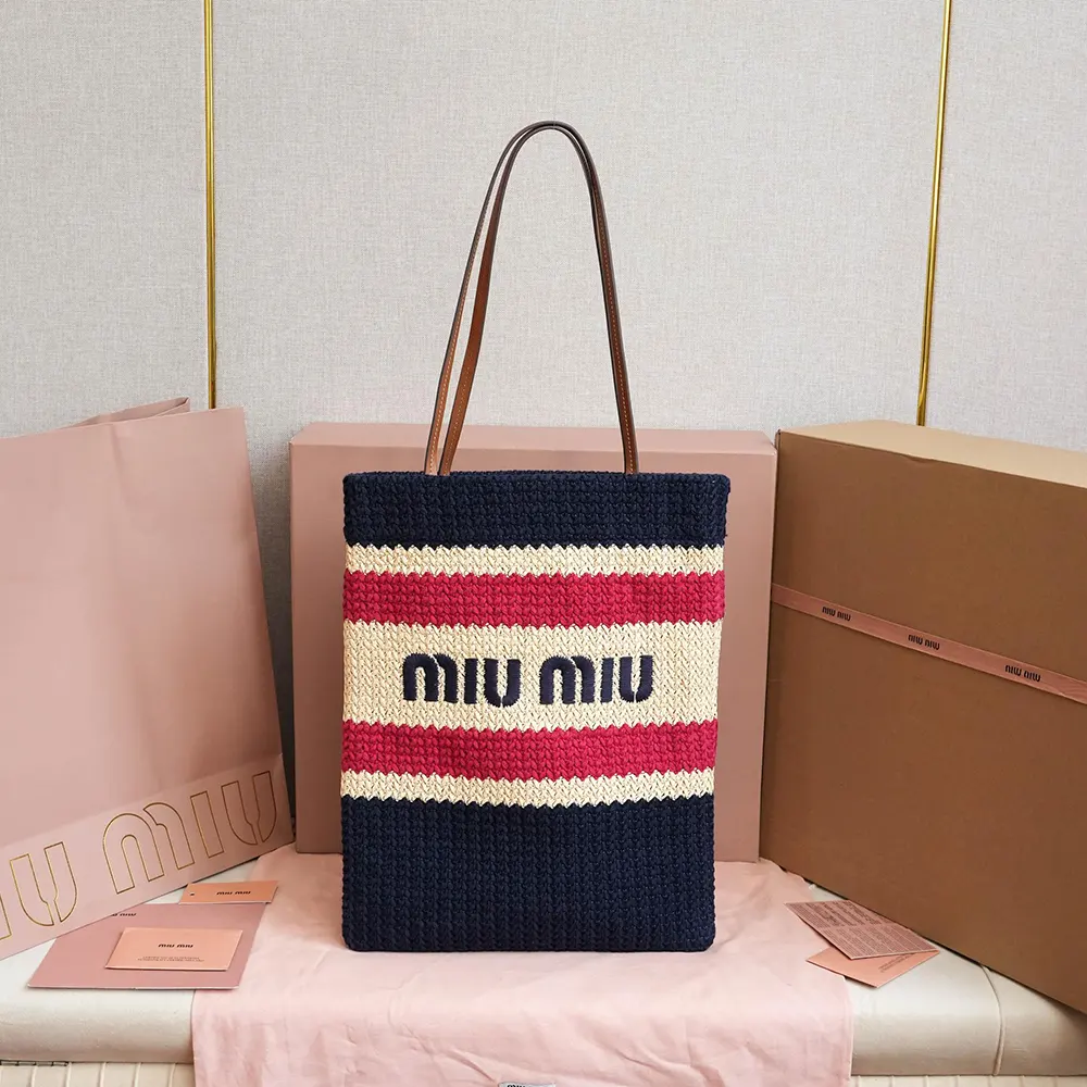 Close-up of gold-tone hardware on Miu Miu Women Raffia-effect Woven Tote Bag