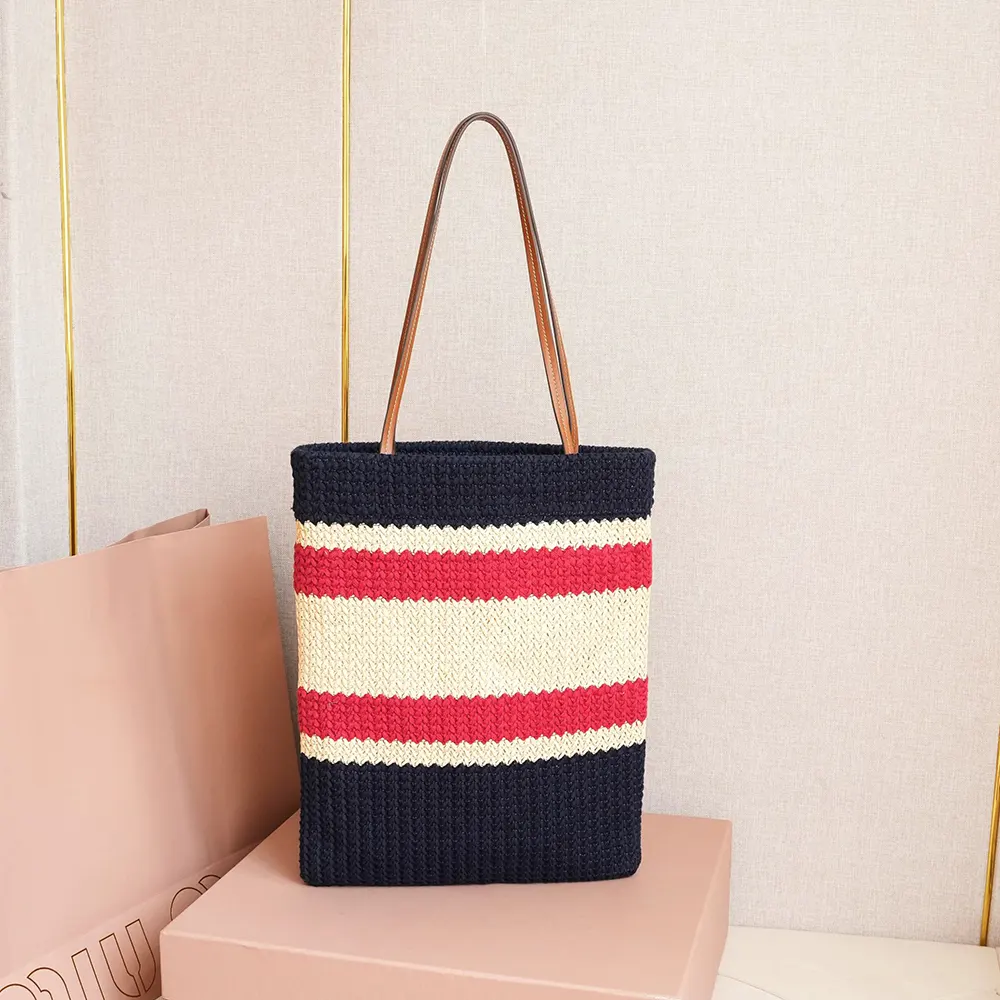 Side angle highlighting woven texture of Miu Miu Women Raffia-effect Woven Tote Bag