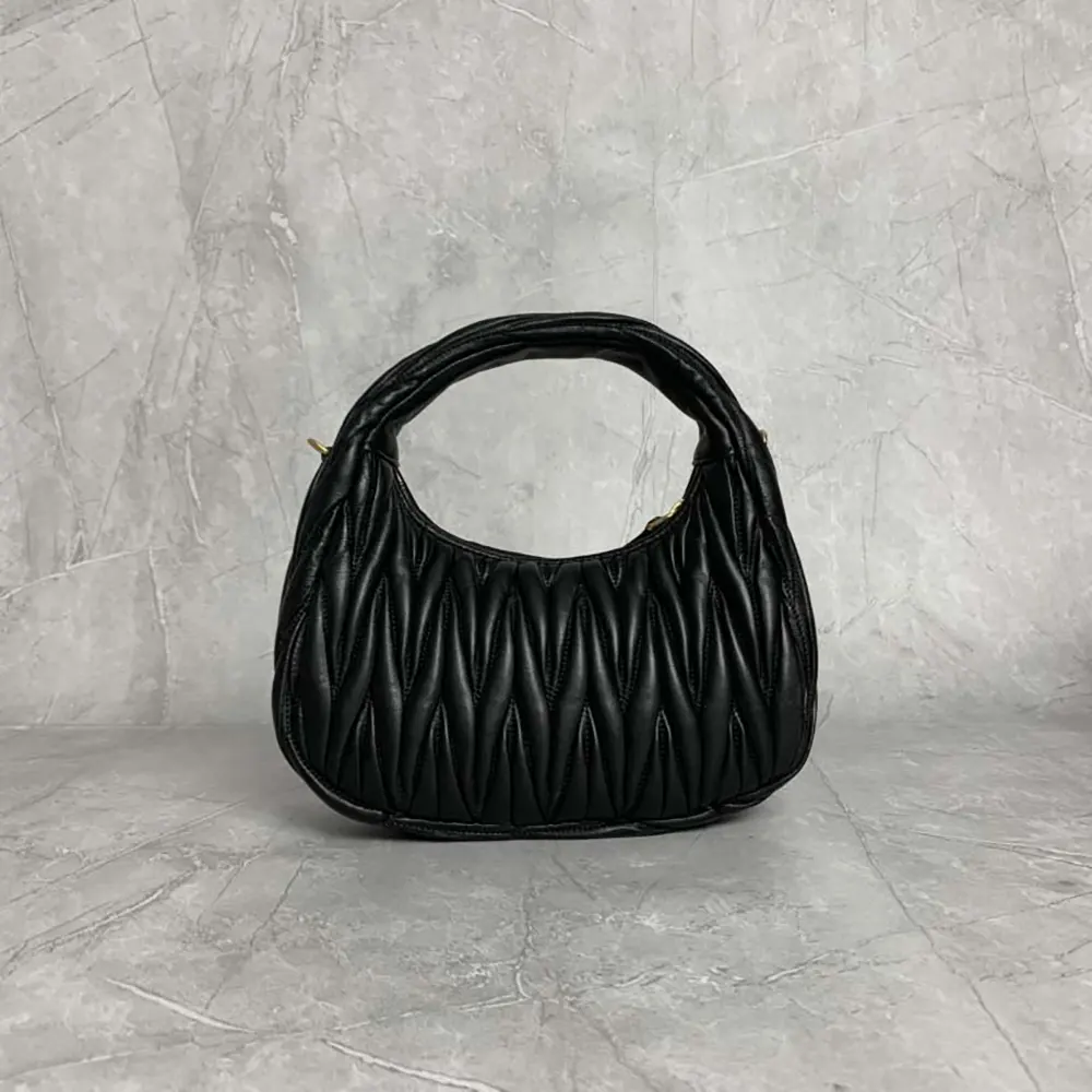 Side angle showing silver-tone hardware on Miu Miu Women Wander Hobo Bag