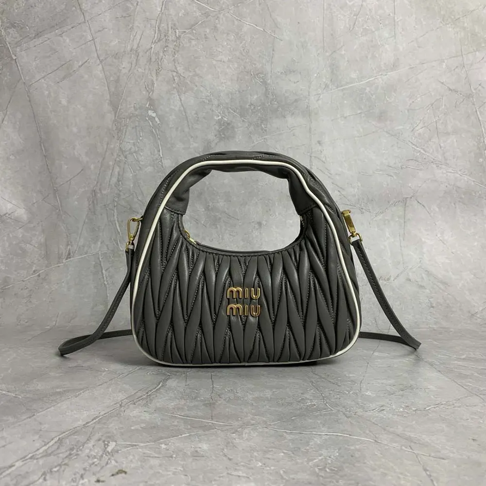 Close-up of silver hardware and matelassé quilting on Miu Miu bag