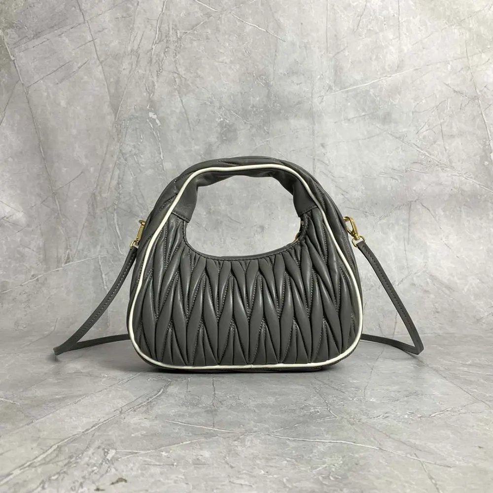 Side profile showing adjustable strap on Miu Miu Women Wander bag