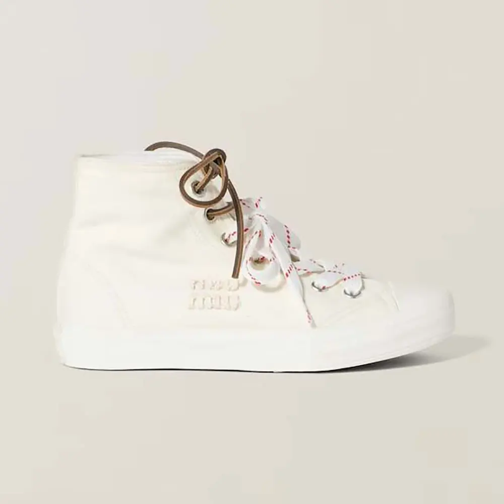 Side view of Miu Miu Women Washed Denim High-top Sneakers in white